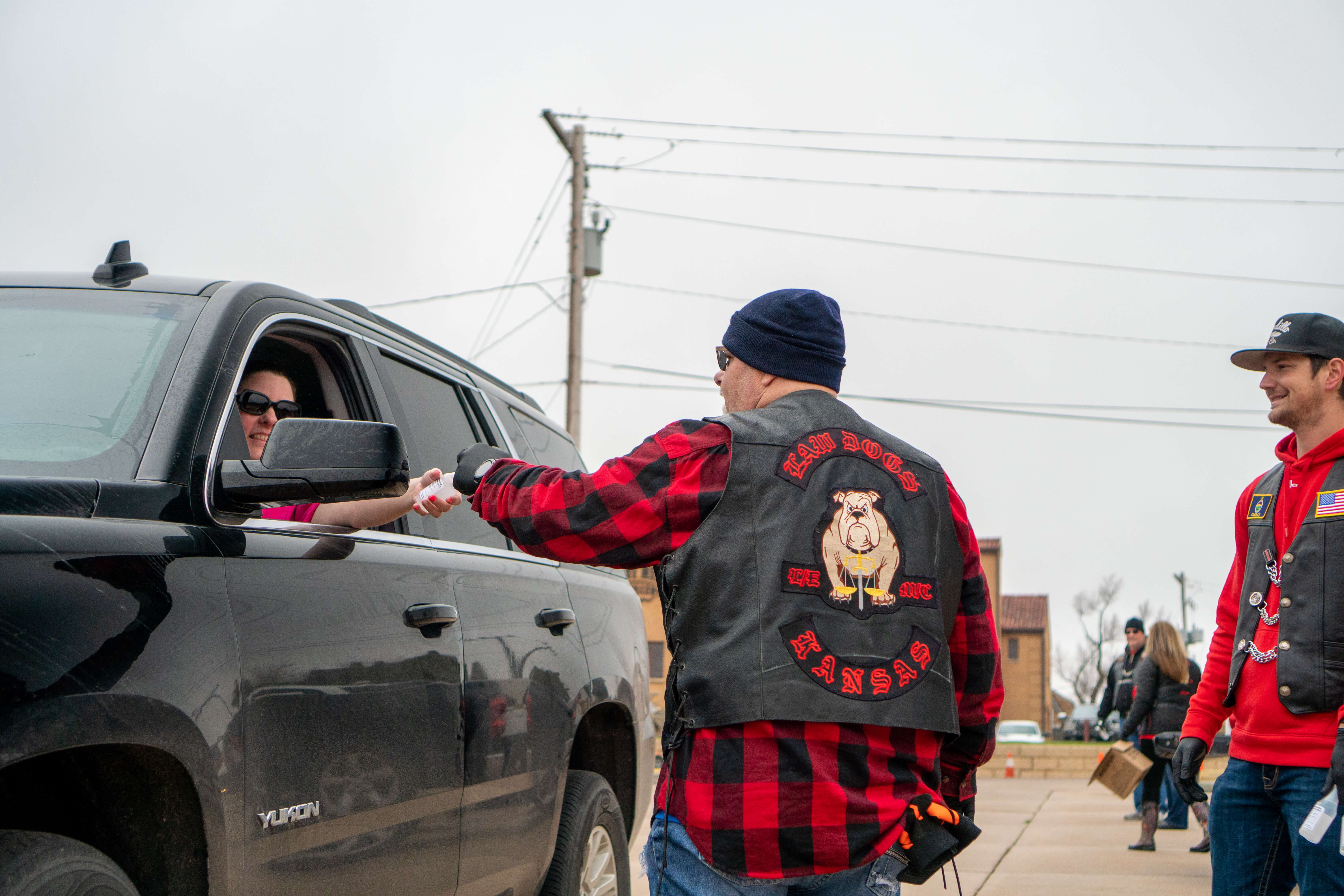 The Kansas chapter Law Dogs motorcycle club came to help distribute hand cleanser!