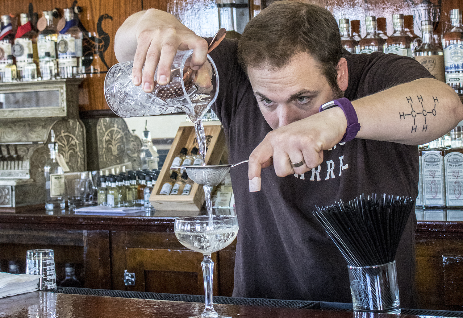 Mark A. Vierthaler pours a cocktail inside The Tasting Room
